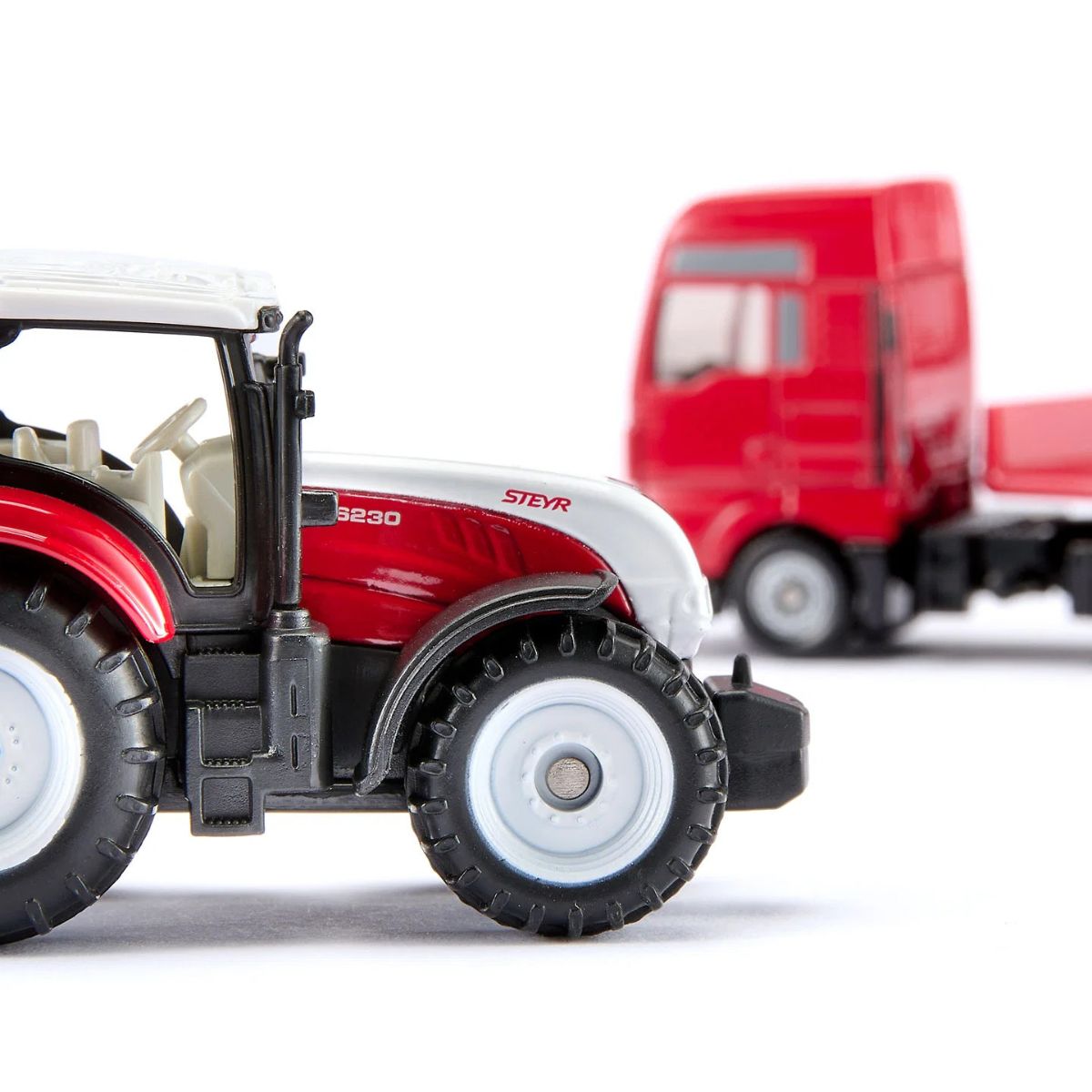 Đồ Chơi Xe Tải MAN Chở Máy Kéo Nông Nghiệp Steyr SIKU 1764
